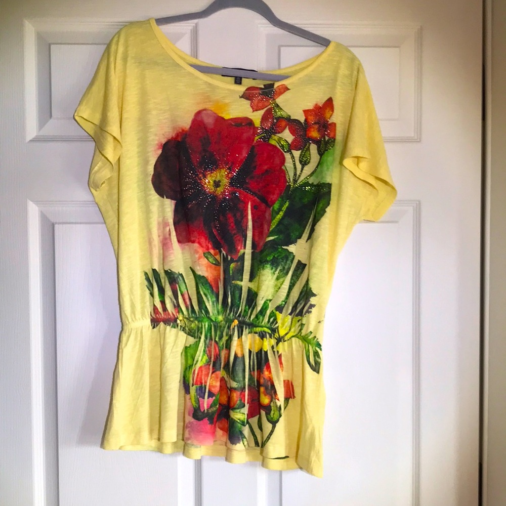 B.L.E.U yellow elastic waist top with a big red flower on front and back.